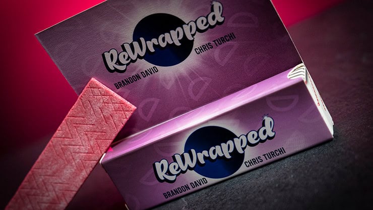 Bright pink and purple ReWrapped packaging with textured wrapping paper and bold logo design.