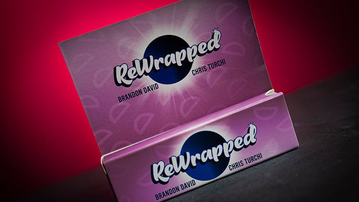 A colorful, branded box with "Rewrapped" logo and names Brandon David and Chris Turchi, set against.