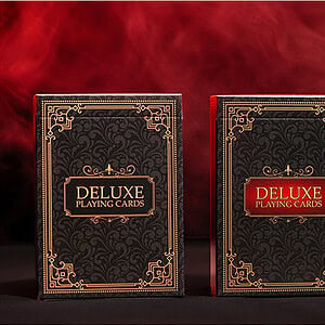 Deluxe playing cards set with ornate black and gold packaging for magic tricks and cardistry.