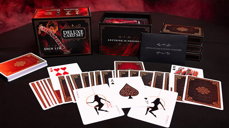 Deluxe magic card set with red and black themed playing cards and accessories.