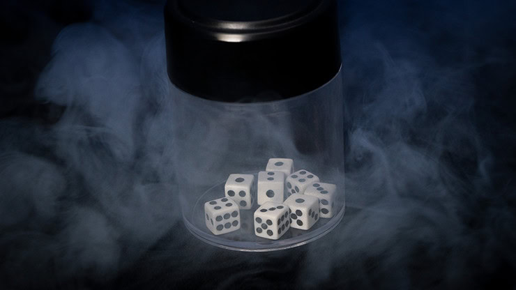 Dice inside a glass container with smoke for magic trick.