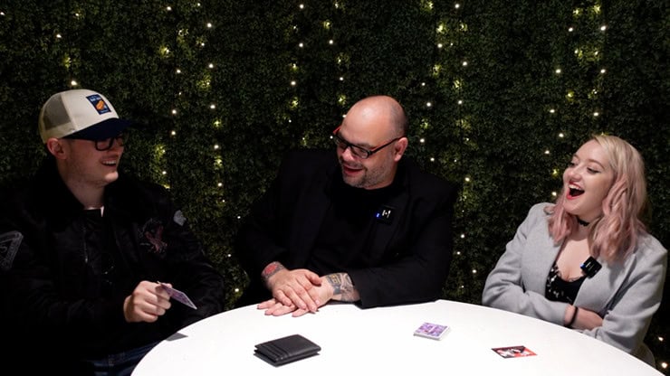 A lively magic performance with two young adults and a magician at Dreamland Magic.