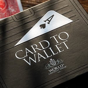 A deck of playing cards with an ace of spades partially inside a black card wallet.