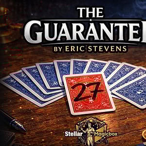 A magic card trick with a red "27" card and blue-backed cards fanned out on a wooden table, related.