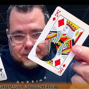 Q9 of Clubs and King of Diamonds magic card illusion with a hole.