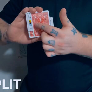Close-up of a magician performing a card split trick with red playing cards.