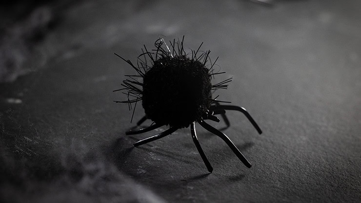 Close-up of a black spider prop used in magic illusions.
