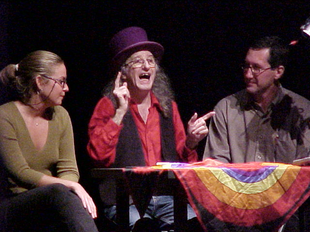 Juan Tamariz performing close-up magic for spectators, wearing his signature purple top hat