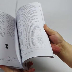 Open book with a keyhole illustration on the page for magic shop products.