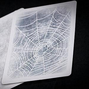 Illusion card with spider web pattern for magic performances.