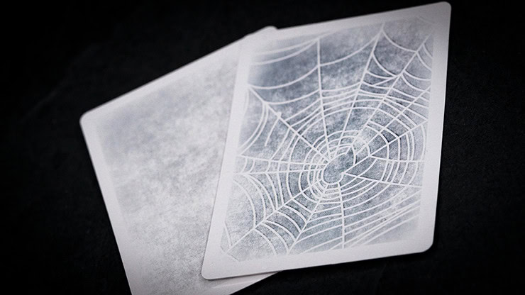 Illusion card with spider web pattern for magic performances.