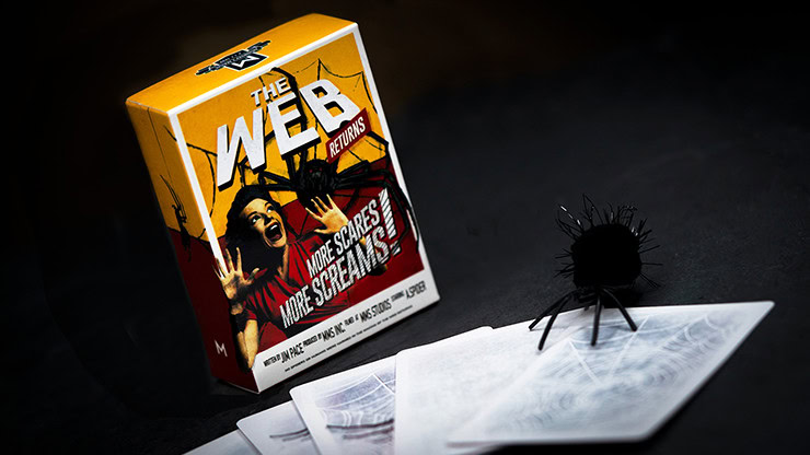 Magic trick with spider and web-themed illusion for entertainment.